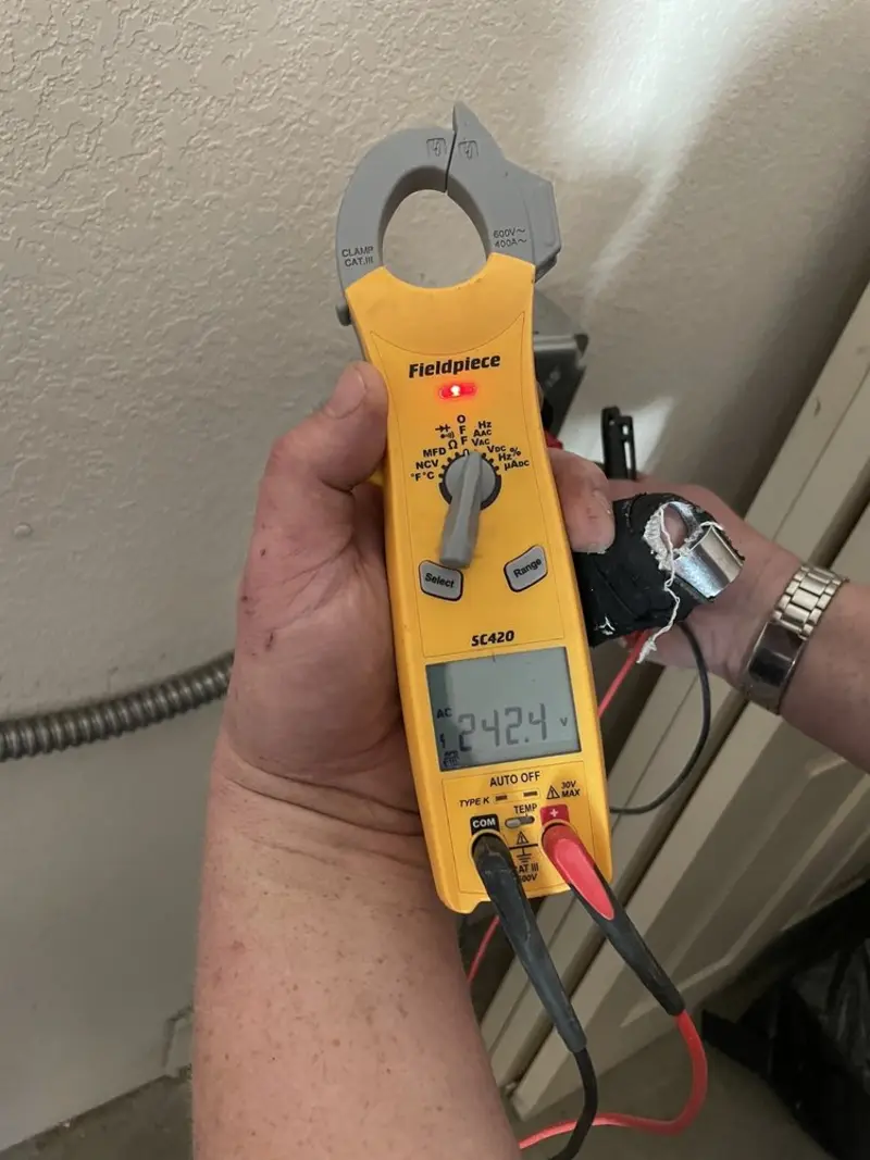 Voltage testing with clamp meter during Circuit Breaker Repair in Leonia
